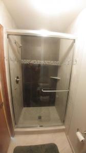 #350 deluxe frameless slider BN clear with single mount tubular towel bar, and single knob
