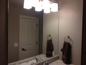 Mirror with holes for light fixture